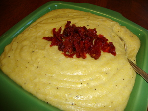 Creamy Parmesan Polenta garnished with chopped sun-dried tomatoes
